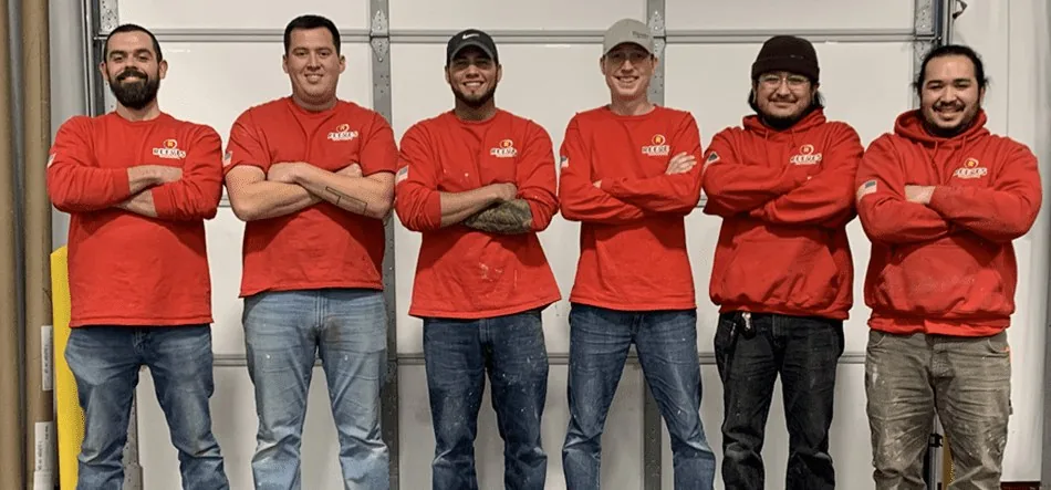 The Reeves Remodeling crew in red company shirts