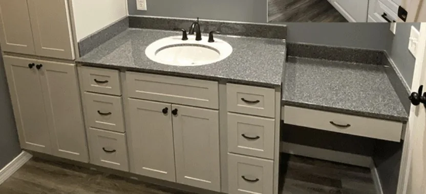 A long vanity run with a makeup counter and speckled countertop